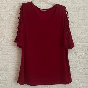 Red top with open criss cross sleeves